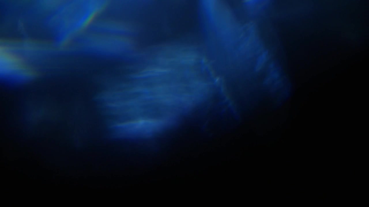 Abstract Blue Light Leaks and Lens Flares on Black Background