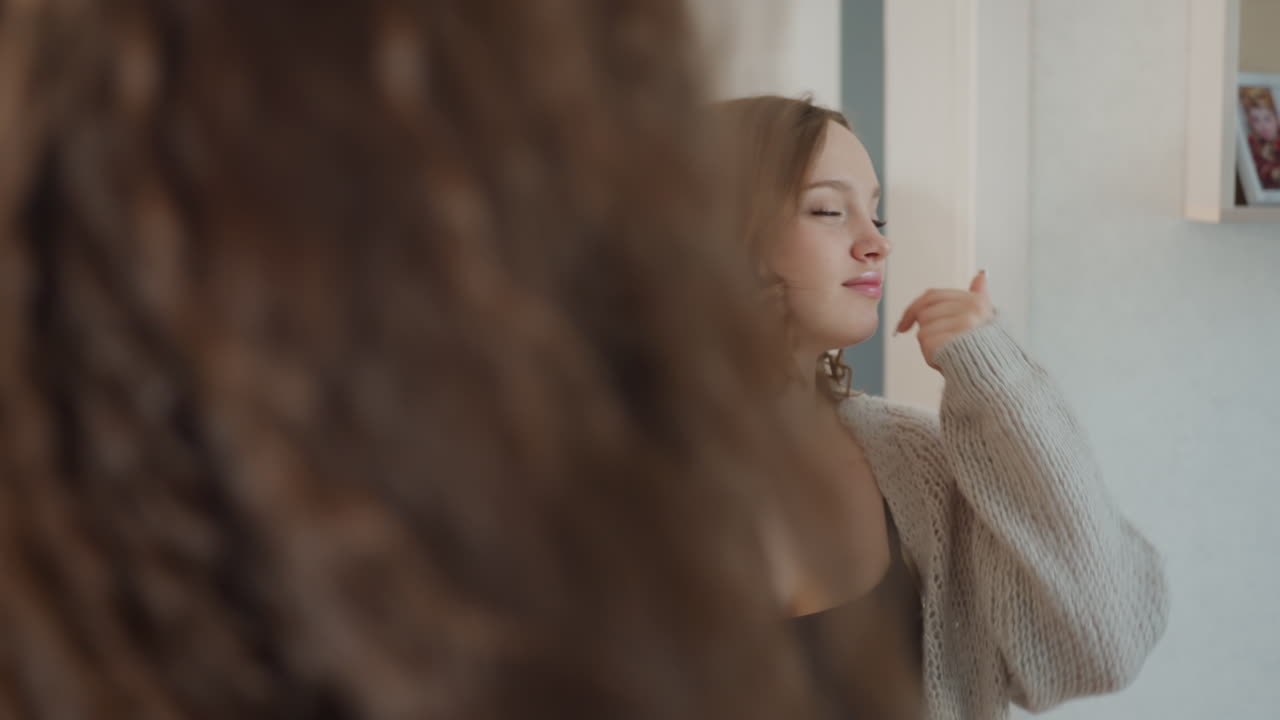 Cosmetic Routine Snapshot, Woman Beautifying Herself In Mirror, Close Up Of Woman Applying Makeup, Joyful Woman Enhancing Her Appearance With Makeup And Bouncing Locks In Front Of Mirror