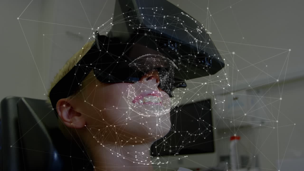 Lille dreng læner sig tilbage iført et virtual reality-headset