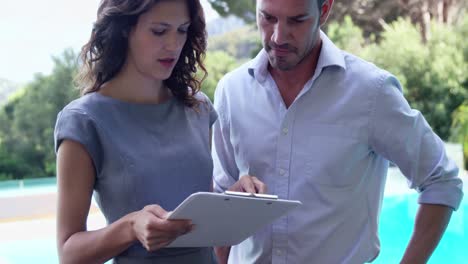 young couple reading documents