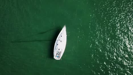 flying above sailboats and boats in fajardo puerto rico revealing beautiful emerald water