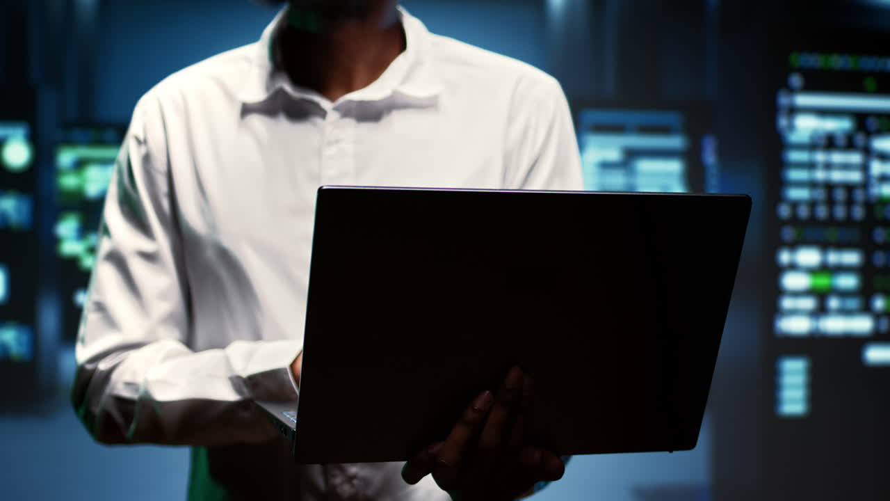 Supervisor walking between rackmounts