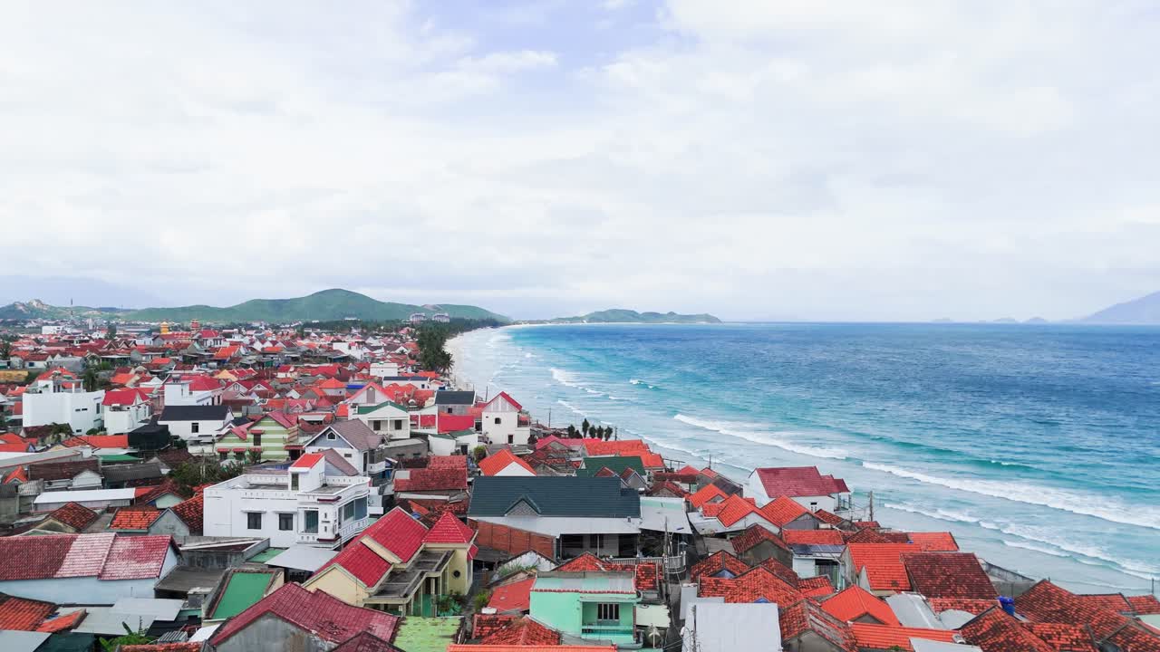 Aerial View Dolly of the Beautiful Coastline and the City in Ninh HòA.