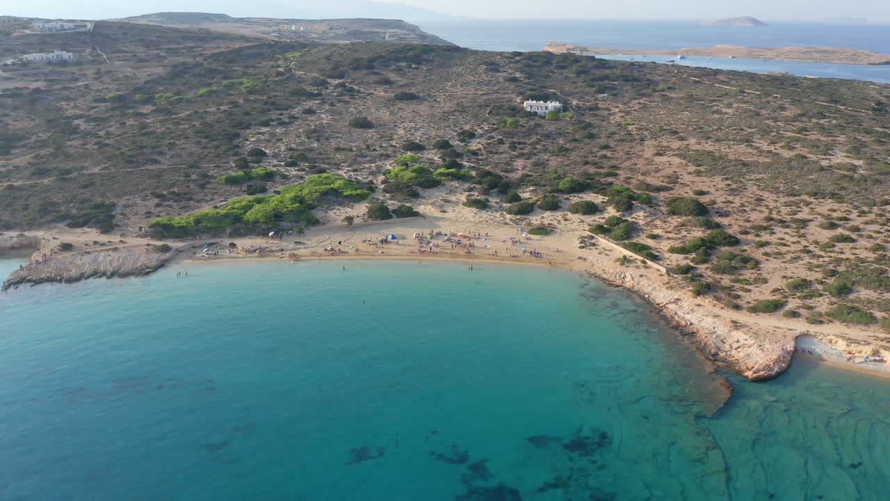 Crowd of tourists at Italida beach of Koufonisia beaches, Ano Koufonisi, Cyclades Islands, Drone shot