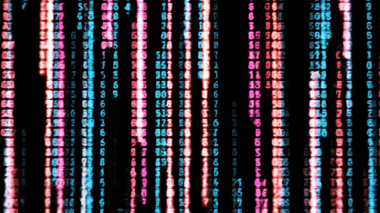 Bright, vivid lights form dynamic lines and patterns, illustrating a mesmerizing digital landscape. The colors pulse and shift, creating an engaging visual experience.