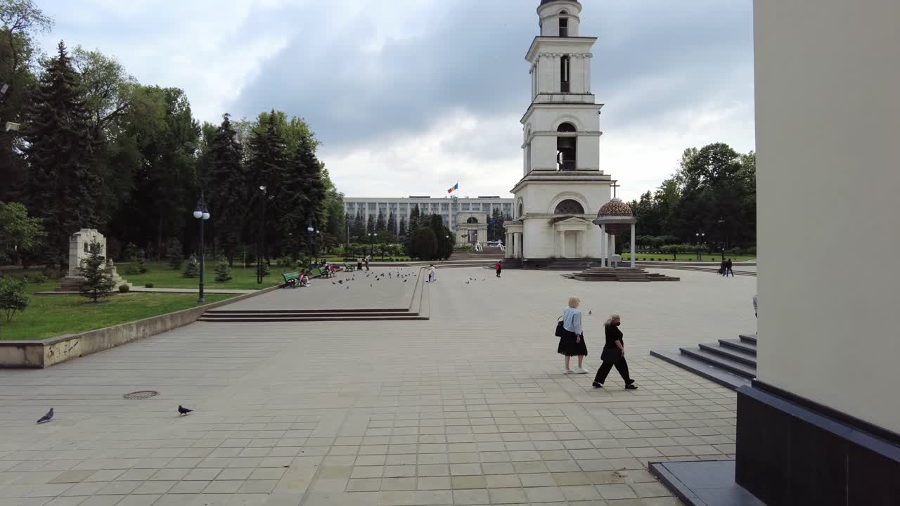 Chisinau, Moldova - May 27, 2021: People walking in the court of the Metropolitan Cathedral of Christ's Nativity