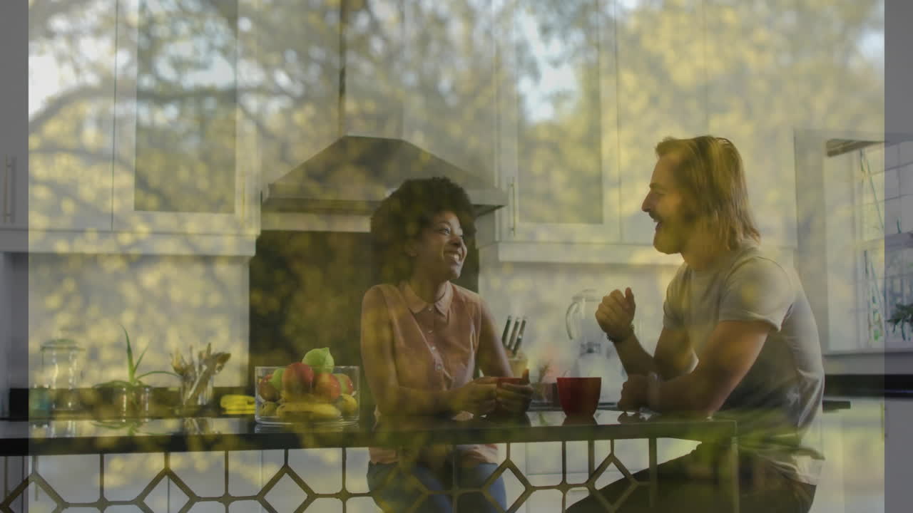 Having breakfast together, smiling couple with garden view at home