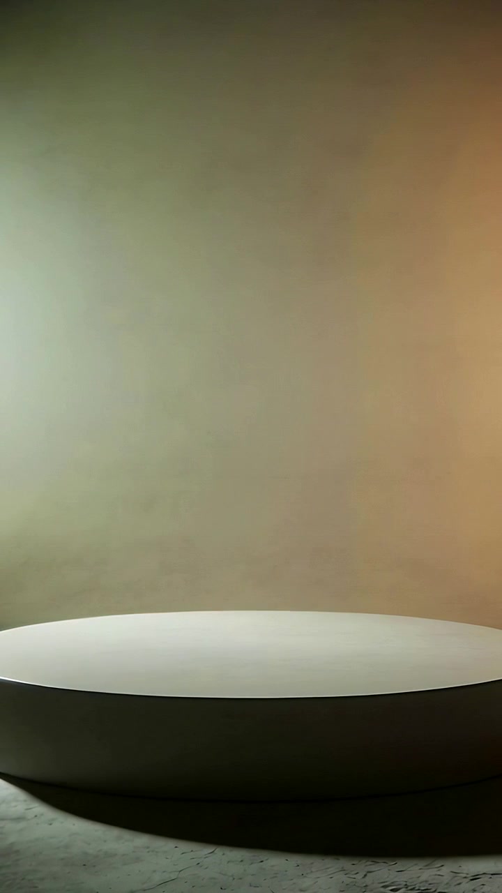Vertical video: Camera opening on empty round plinth centered in studio, lit teal amber for product