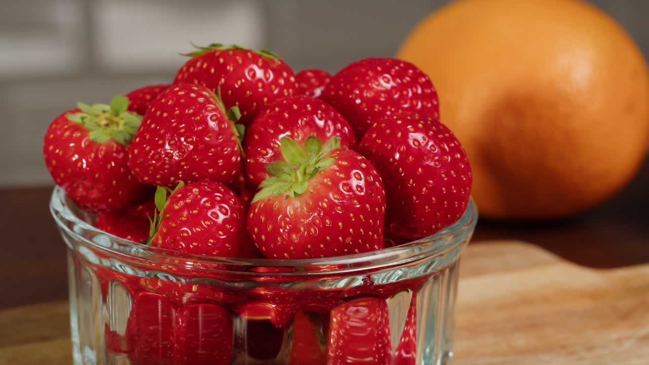 Fresh Ripe Strawberries in a Glass Bowl