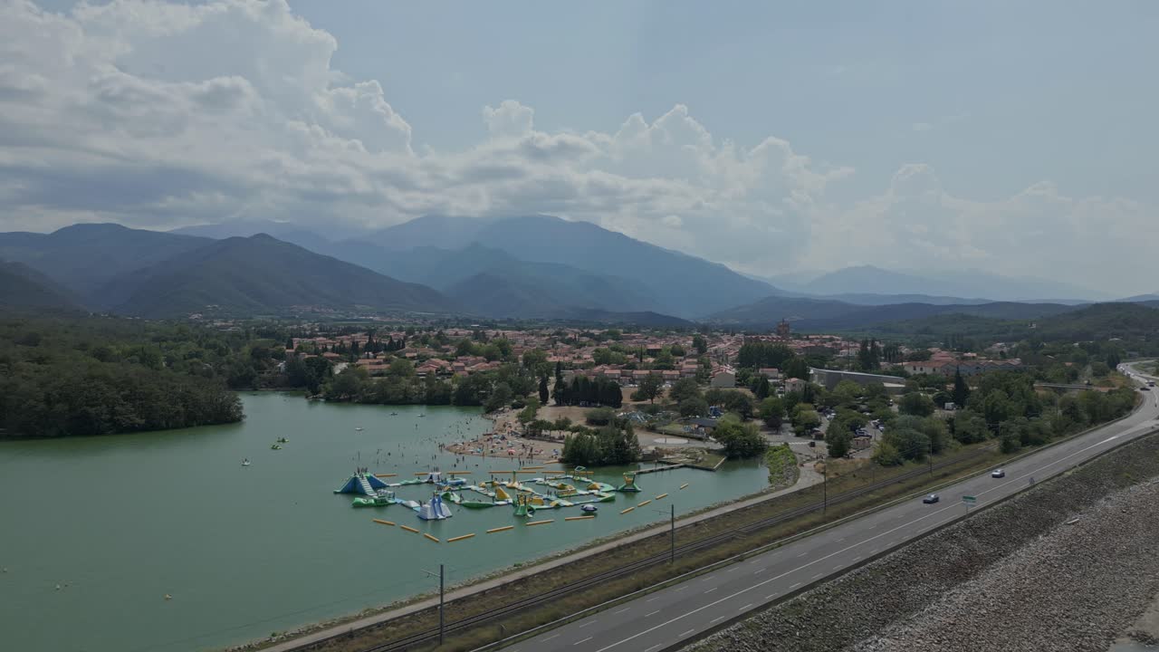 Aerial View of Lake with Water Park and Mountain Scenery