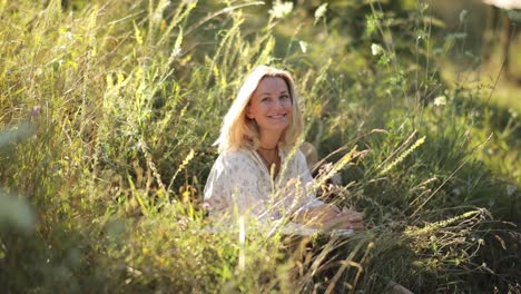 woman relaxing in a grassy field