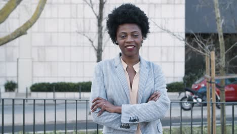 Medium-view-of-smiling-woman-with-crossed-arms