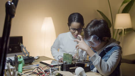 two smart kids doing interesting project together