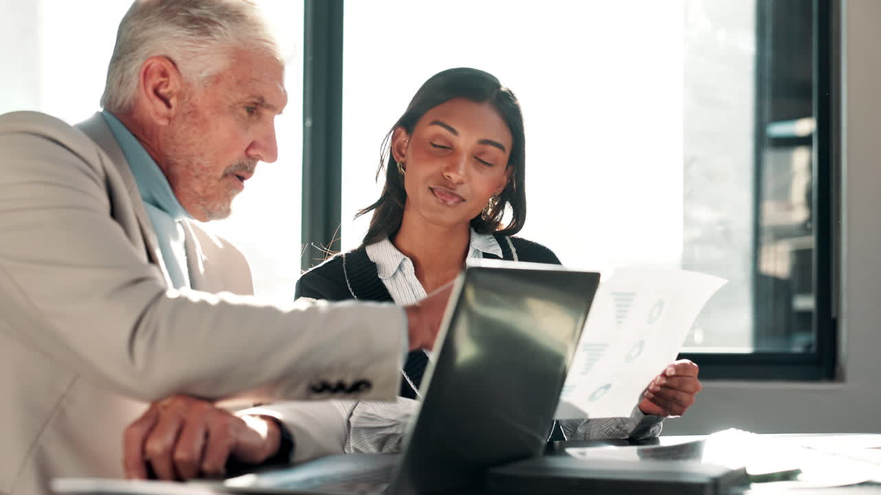 Business professionals collaborating on a project in the office