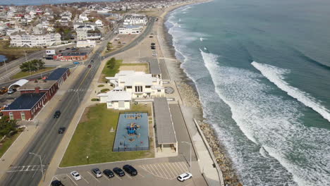 Aerial-Hyperlapse-of-Hull,-MA,-showing-coastline-and-traffic