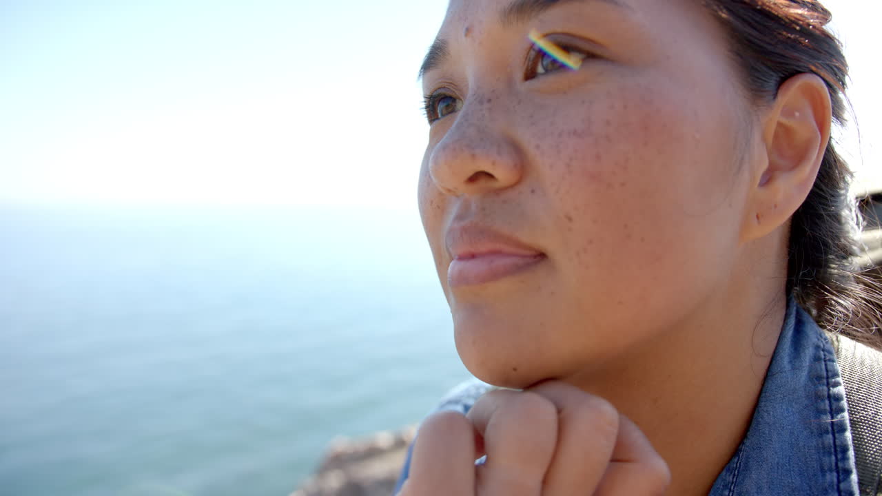 Enjoying mountain hike, woman gazing at scenic view with serene expression