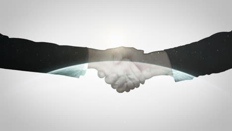Two business people shaking hand in front of globe