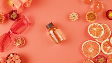 coral orange beauty products flat lay