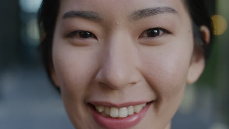 close-up-portrait-beautiful-young-asian-woman-student-smiling-enjoying-lifestyle-cute-happy-girl-looking-at-camera-slow-motion-feminine-beauty