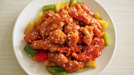 fried crispy chicken with sweet and sour sauce in korean style