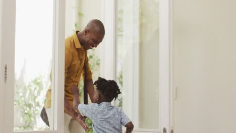 Father-embracing-his-son-at-home