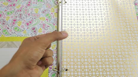 using ring binder reinforcers for shiny ornate paper pages in file