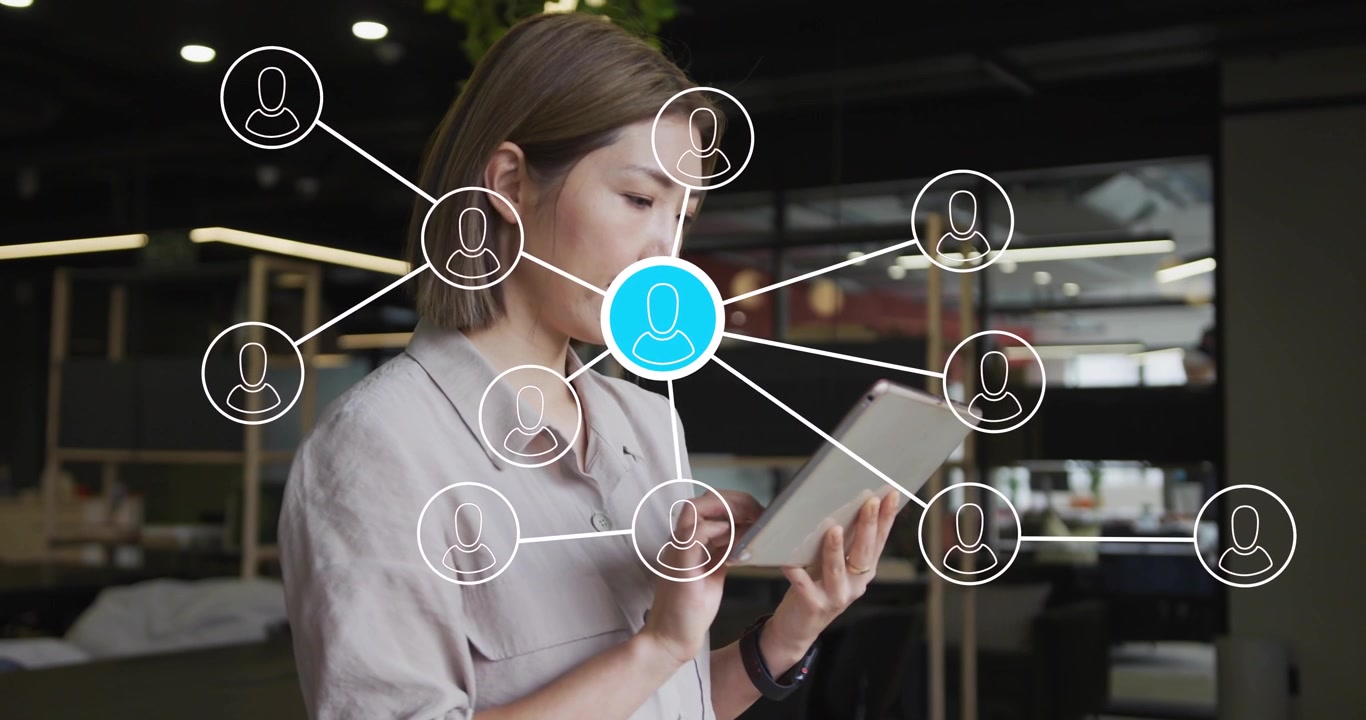 Business user tapping tablet while network overlay showing user links, blue node drifting to tablet