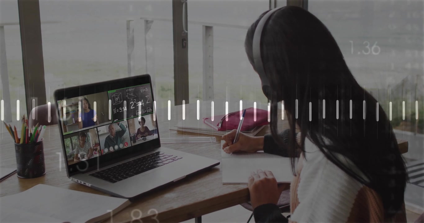 Student with headset writing math while teacher speaking showing waveform on laptop in online class