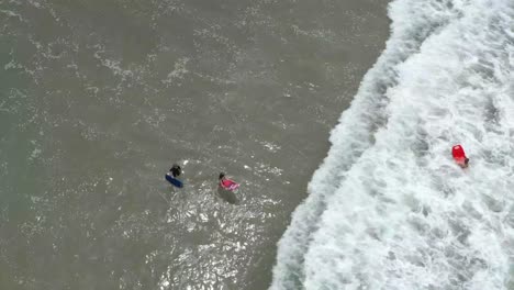 kids body boarding at ventura, california beach