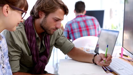 Designers-drawing-together-on-their-desk