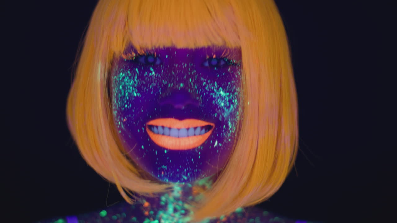 Woman with Neon Makeup and Orange Wig