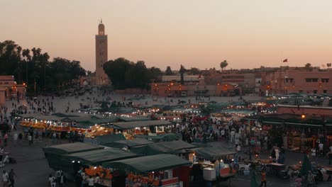 marrakech, morocco - may 15 2019: djemaa el-fna at marrakech, morocco. top view of the unesco square on ramadan kareem on sunset