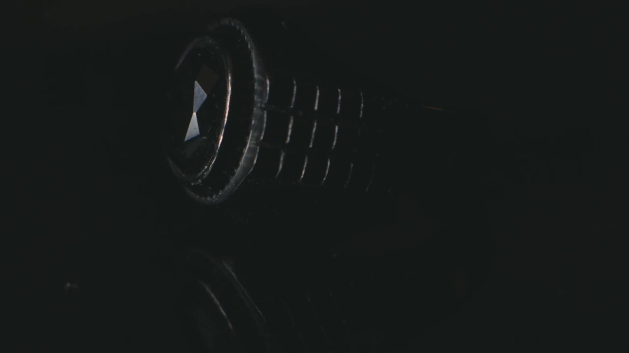 Fancy Ring With Black Gemstones Lies On A Table Strike With A Glimpse Of Light. - close up shot