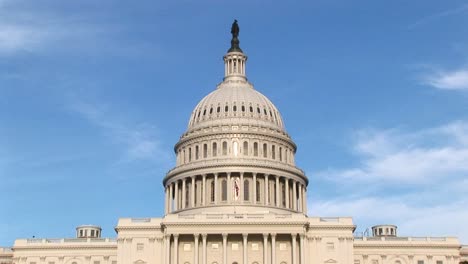 Panning-Up-On-The-Us-Capitol-Building-In-Washington-Dc-From-Ground-Level-To-Its-Landmark-Rotunda-Dome-And-The-Freedom-Statue-On-Top