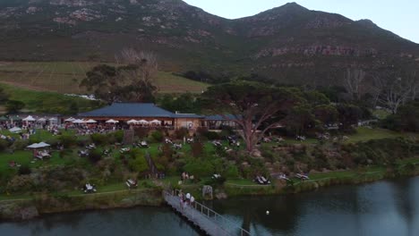 Drone-shot-of-a-vineyard-in-Cape-Town---drone-is-reversing-from-the-restaurant-and-outside-areal