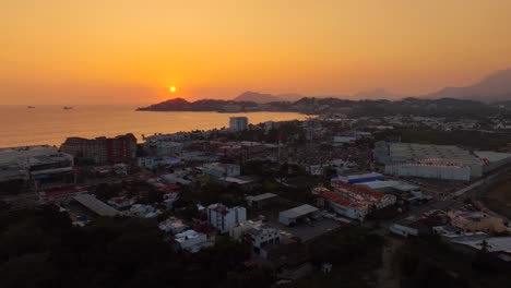 golden hour over the horizon at santiago peninsula from soriana hypermarket area in manzanillo, colima, mexico