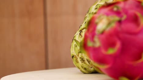 various fruits arranged on a wooden surface