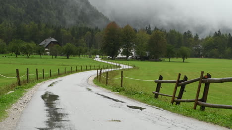 rainy day in alpine valley with low clouds, logarska dolina, slovenia, european alps, bad travel weather, hiking in mountains, hd