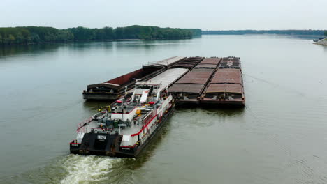 container ship sails in the danube river in vukovar city, croatia