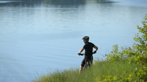 cyclist riding a bike. extreme mountain bike sport athlete man riding outdoors