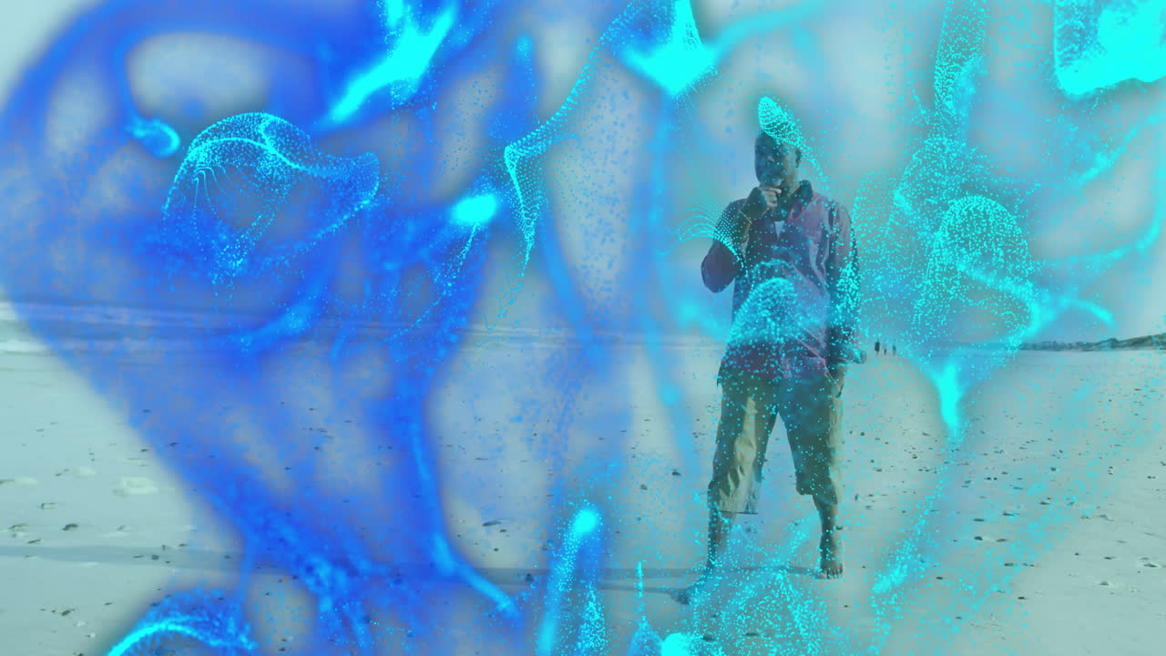 Man talking on smartphone on sandy beach, showcasing technology with swirling digital particles