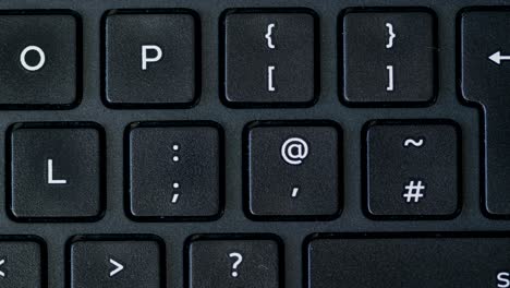 Top-View-Finger-Pushing-Apostrophe-Button-Keyboard