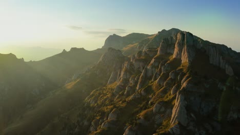 drone view over ciucas peak at sunset, beautiful mountain scenery in romania