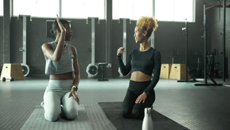 two women in a gym after a workout
