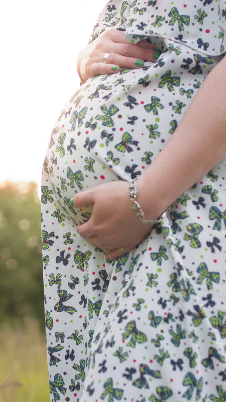 Pregnant woman in dress vertical video