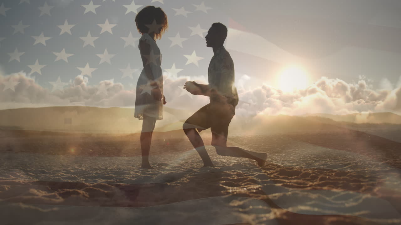 해변에서 여자친구에게 청혼하는 두 인종 남성 위에 미국 국기의 애니메이션