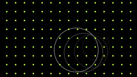 animation of white rings moving over grid of pulsating yellow dots, on black background