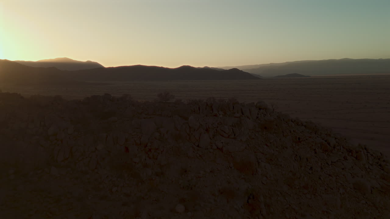 Sunrise or Sunset over Desert Mountains