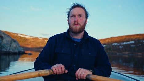 close-up of man paddling boat in reinsjoen, norway
