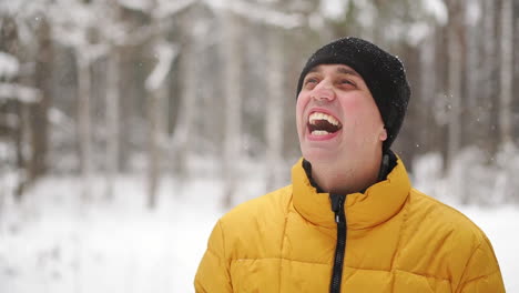 close up portrait of young man traveler. happy hiker, climber looking at the top of mountain in slow motion